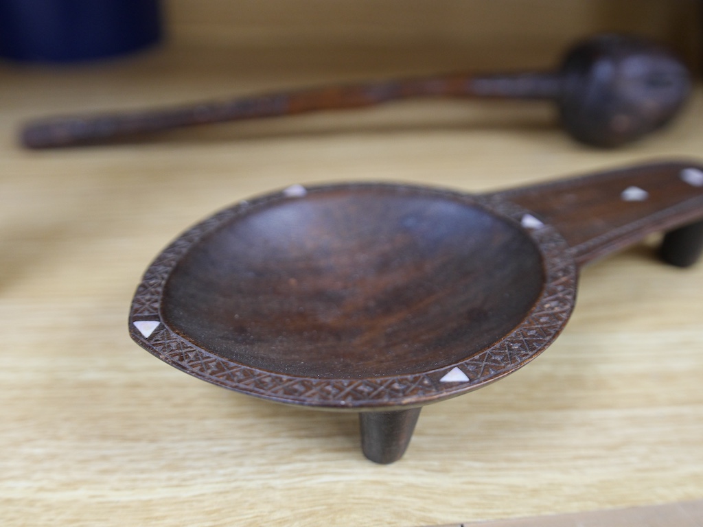 A Fijian throwing club, ula, and Fijian Kava oil bowl with mother of pearl inlay, largest 38cm in length. Condition - good